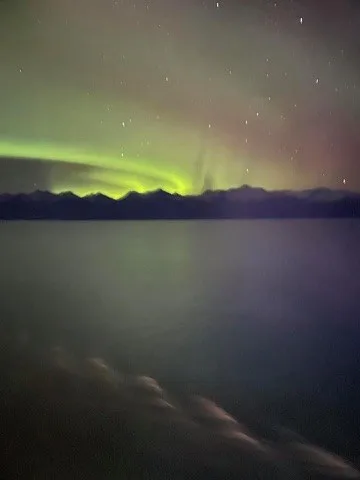 Aurora over dark mountains and Alaska waters — Alaska — Aurora Borealis and Inside Passage