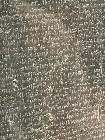 Close detail of the Rosetta Stone inscriptions — London — British Museum and Rosetta Stone