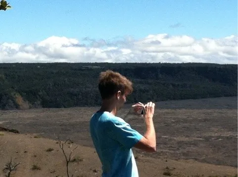 Justin photographing the volcanic caldera — Hawaiʻi — Volcanoes National Park