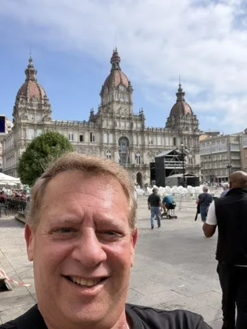 Scott before the monumental city façade — La Coruña, Spain