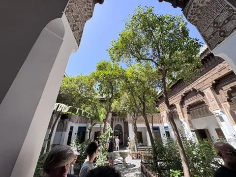Garden courtyard framed by an arch — Marrakesh, Morocco