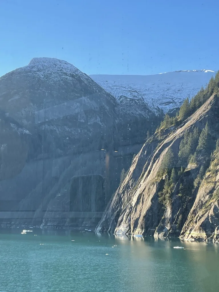 A closer view of the Alaska glacier above turquoise water — Alaska — Aurora Borealis and Inside Passage