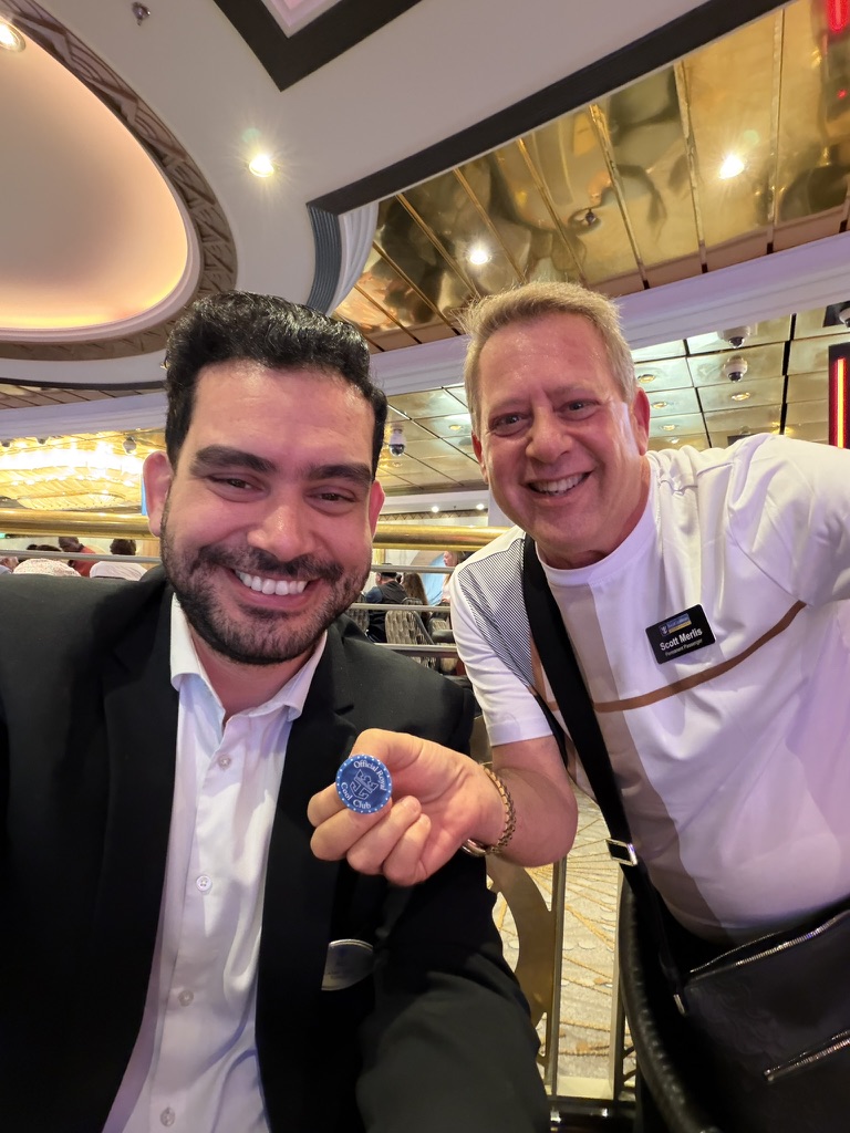 A welcome with personality: Scott A. Astin smiling beside a formally dressed man holding a blue keepsake pin