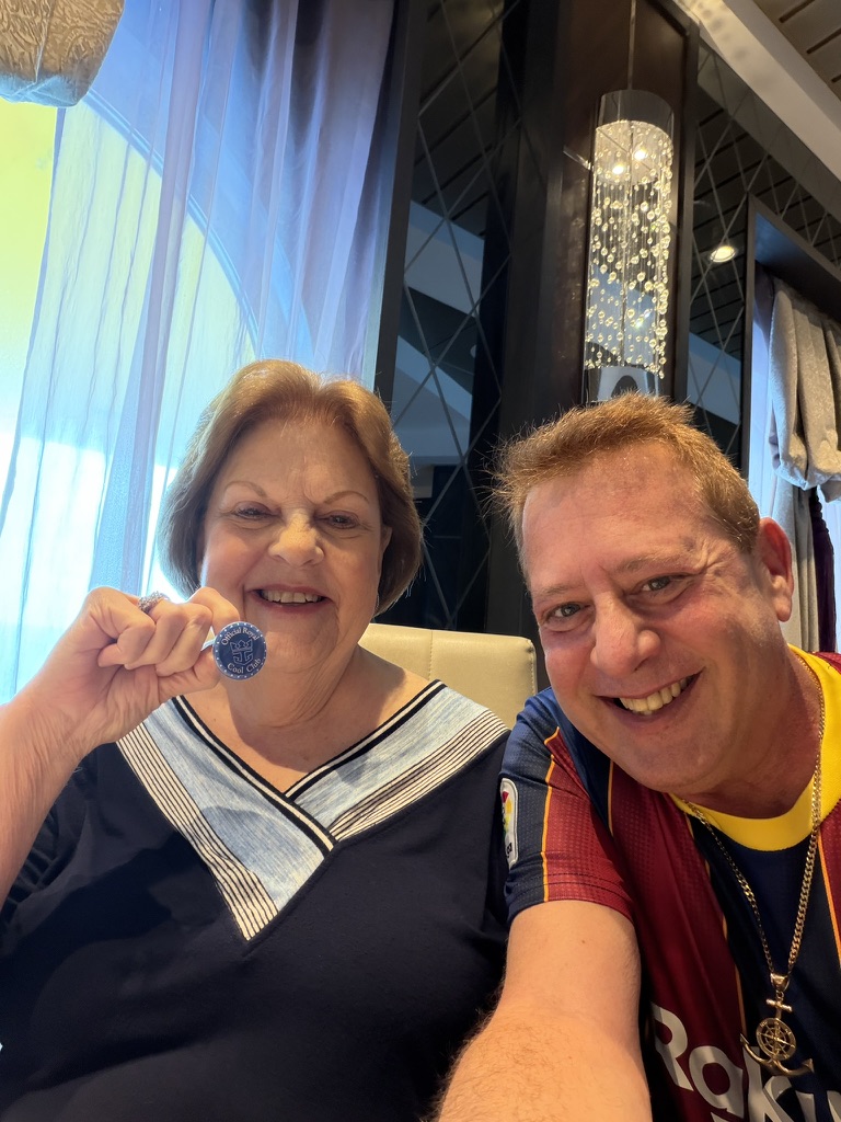 One more reason to celebrate: Scott A. Astin beside a fellow traveler displaying a blue keepsake pin