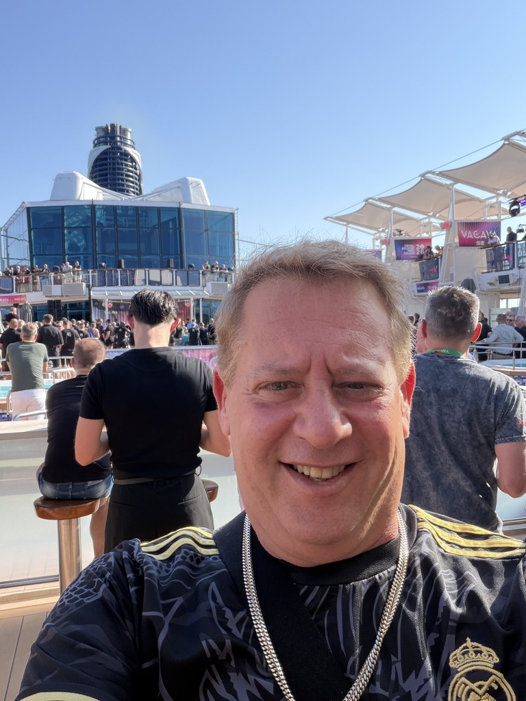 Scott Astin smiling on deck during a voyage