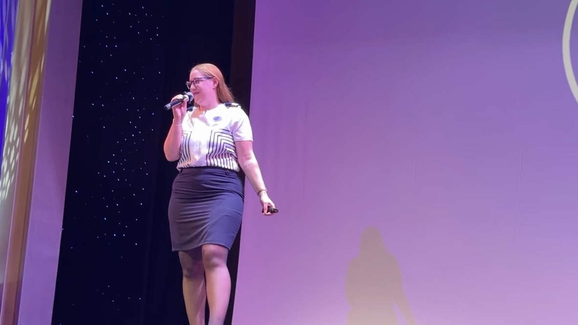 A Navigator of the Seas team member speaking at the Pinnacle ceremony