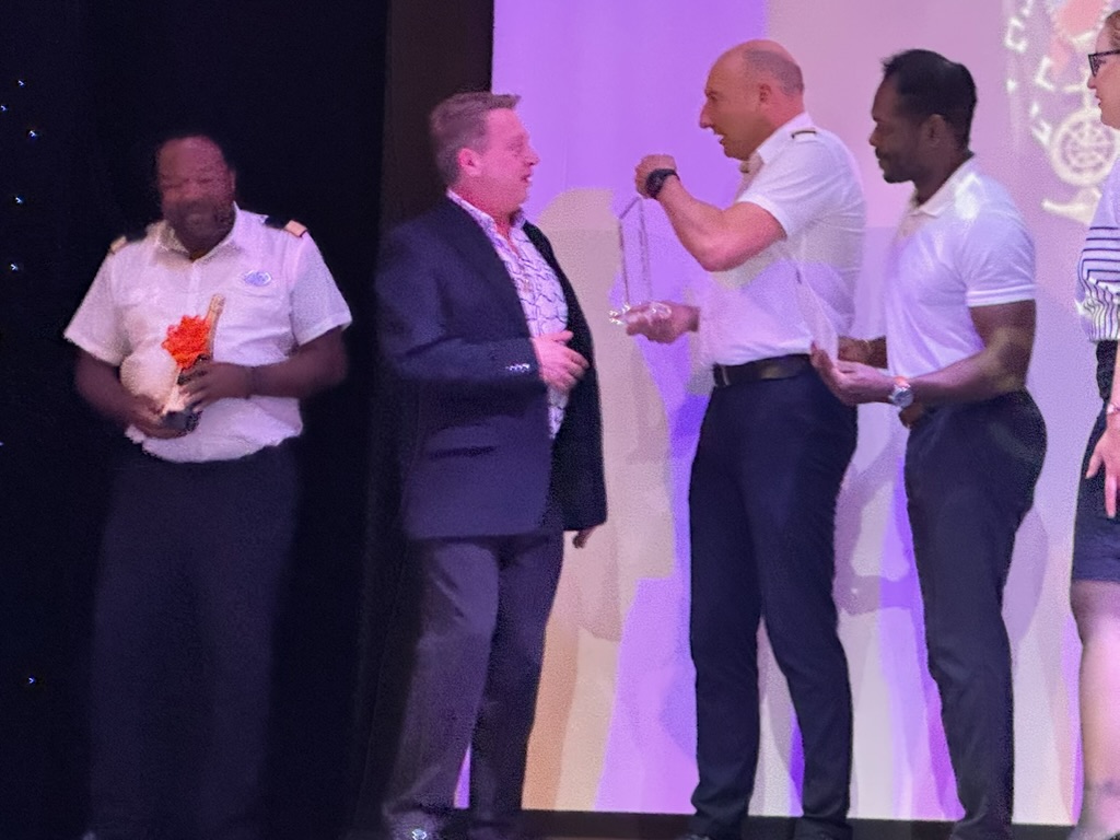 Scott Astin receiving recognition during the Pinnacle ceremony aboard Navigator of the Seas