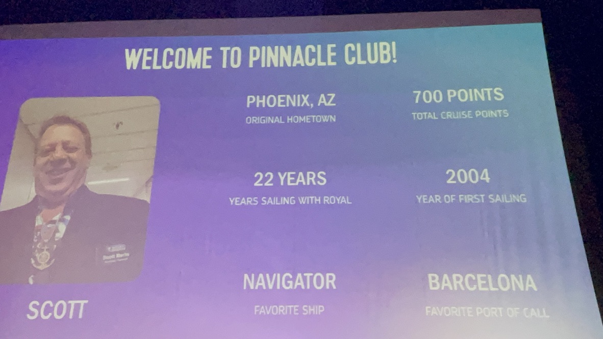 Navigator of the Seas theater screen welcoming Scott to the Pinnacle Club at 700 cruise points